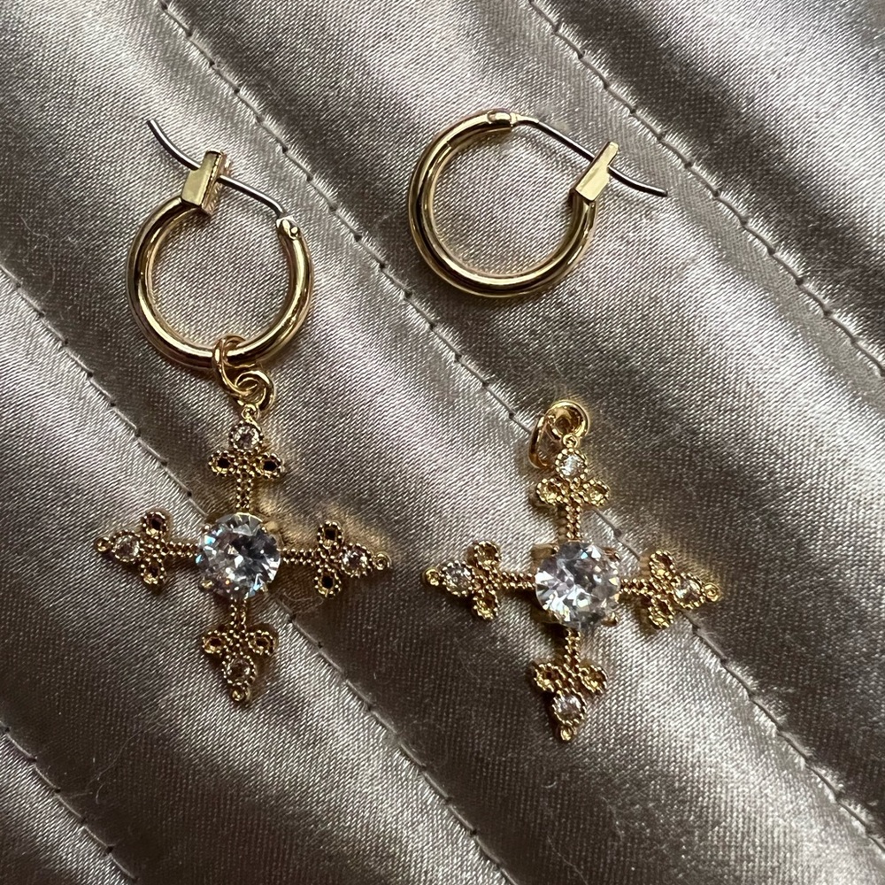 Pair of gold huggie earrings with crosses (that can be removed)